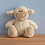 A stuffed animal sits on a wooden table, showcasing its soft texture